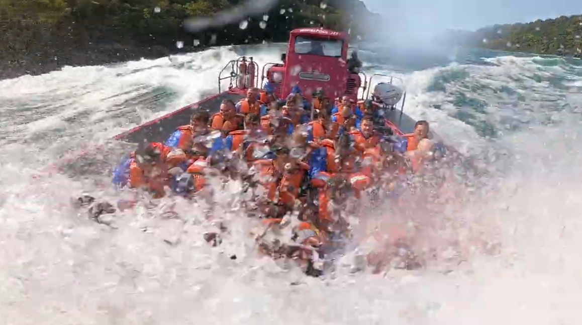Jet boat crashing through the rapids