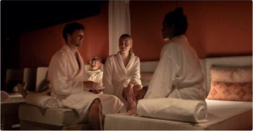 Guests relaxing in robes at the spa